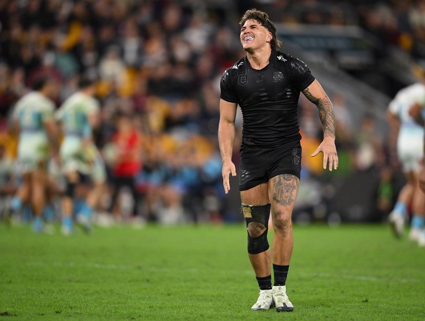 Reece Walsh grimaces in pain.