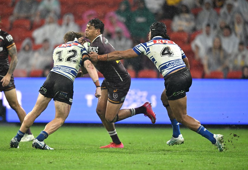 Selwyn Cobbo carries the ball for the Broncos.