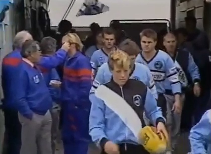 Current Sharks coach Craig Fitzgibbon leads the side out as a ballboy in 1990.