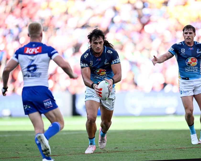 Tino Fa'asuamaleaui with the ball against the Bulldogs.