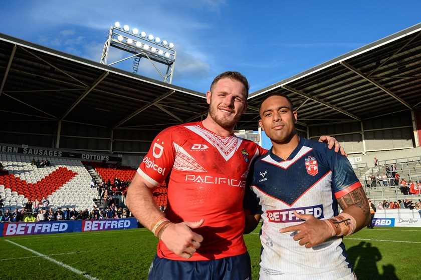 Burgess poses for a photo with Rabbitohs teammate Tevita Tatola after the first Test.