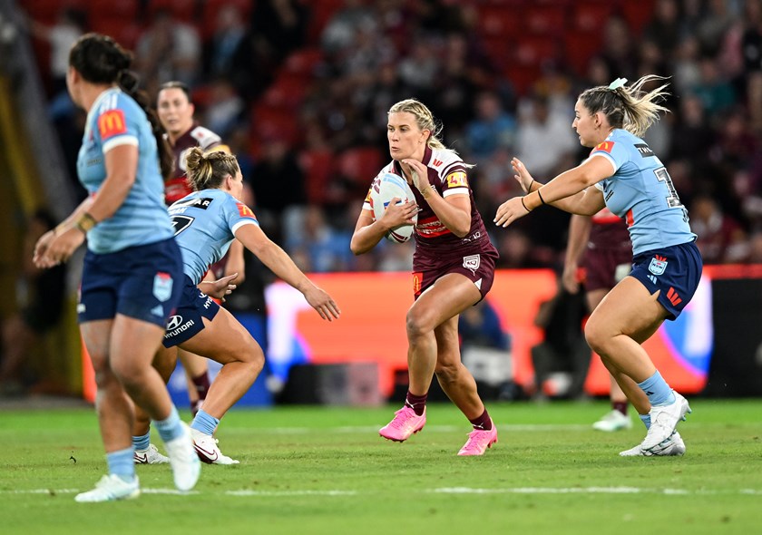 Shenae Ciesiolka takes a tough run for Queensland.