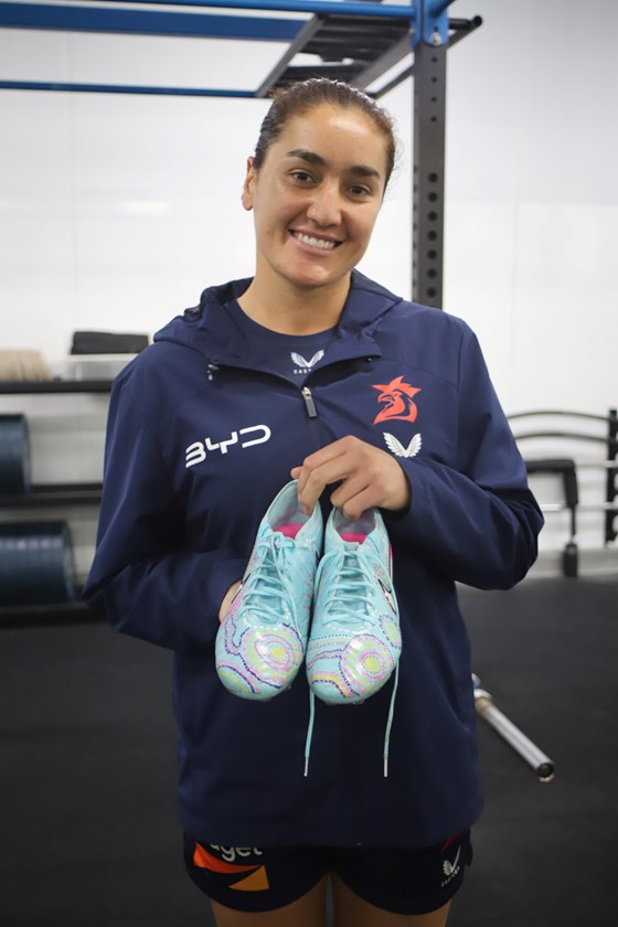 Olivia Kernick with her special Indigenous Round boots.