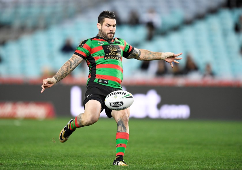 South Sydney No.7 Adam Reynolds launches a kick.