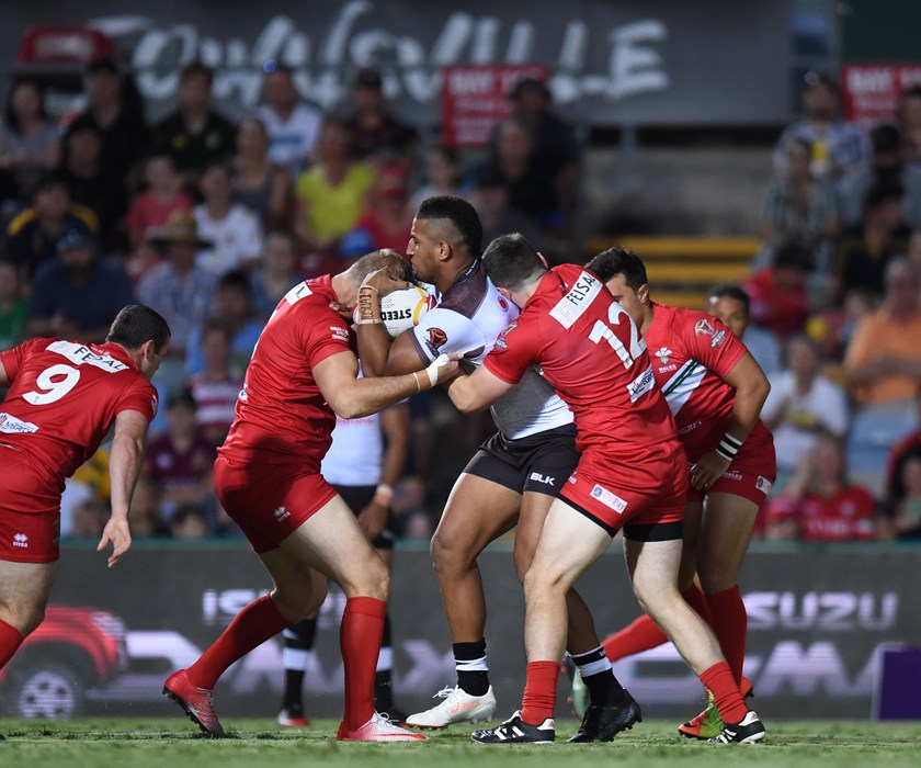 Viliame Kikau hits the ball up for Fiji.