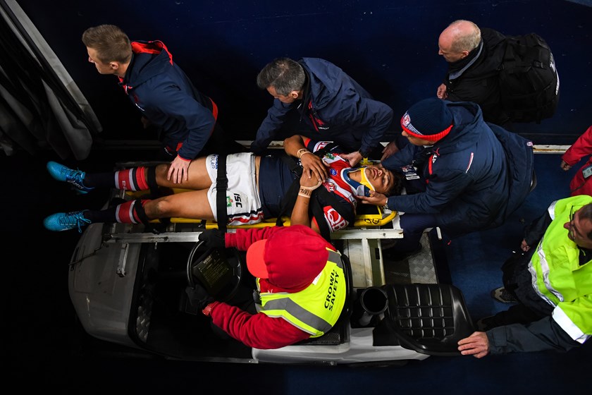 Sydney Roosters centre Latrell Mitchell is taken from the field.