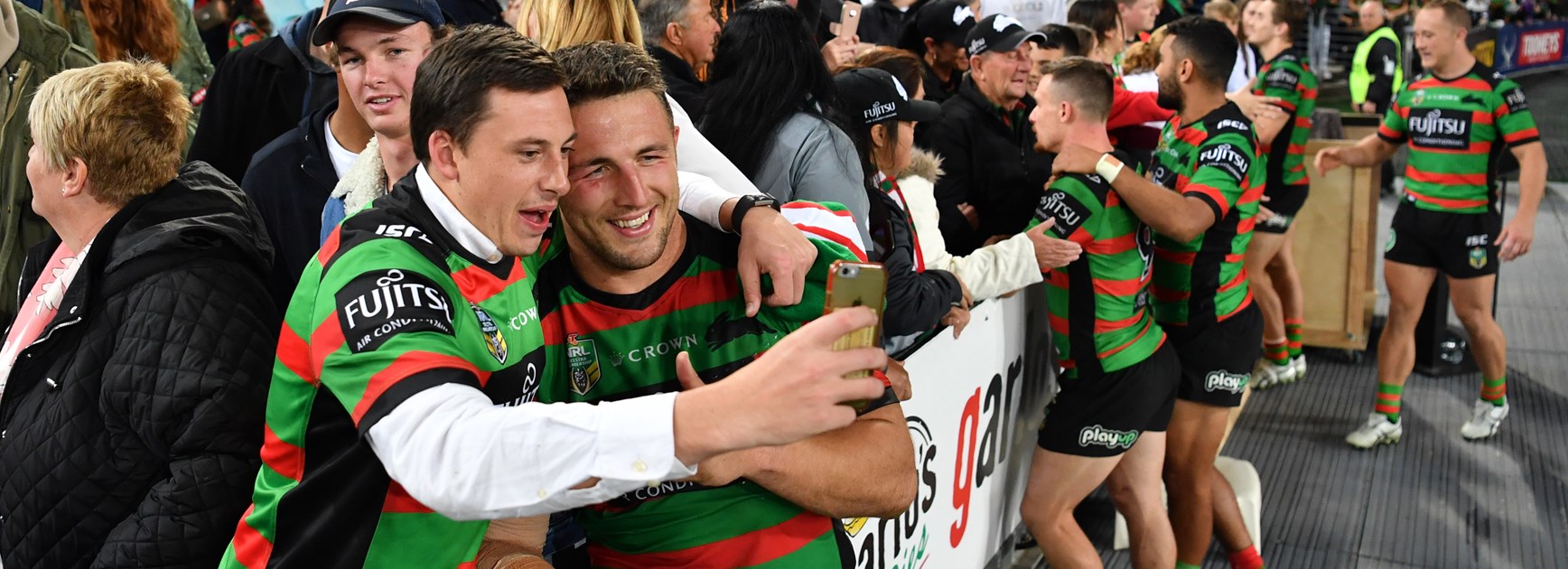 South Sydney captain Sam Burgess celebrates the win.