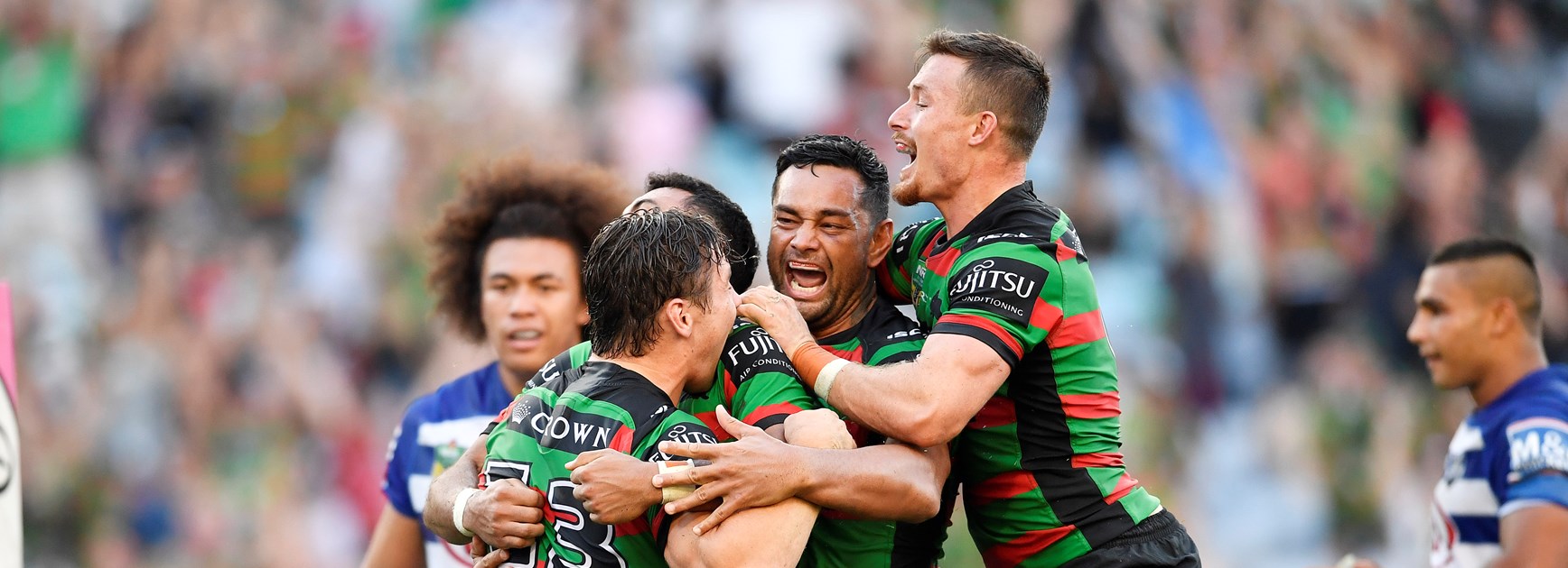 The Rabbitohs celebrate lock Cameron Murray's match-winning try against the Bulldogs.