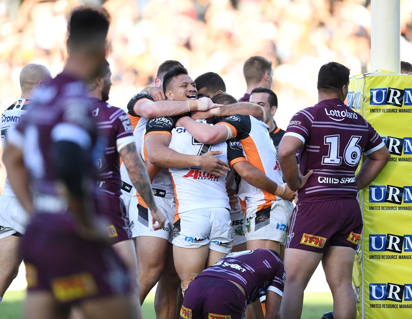 Luke Brooks is congratulated after scoring.