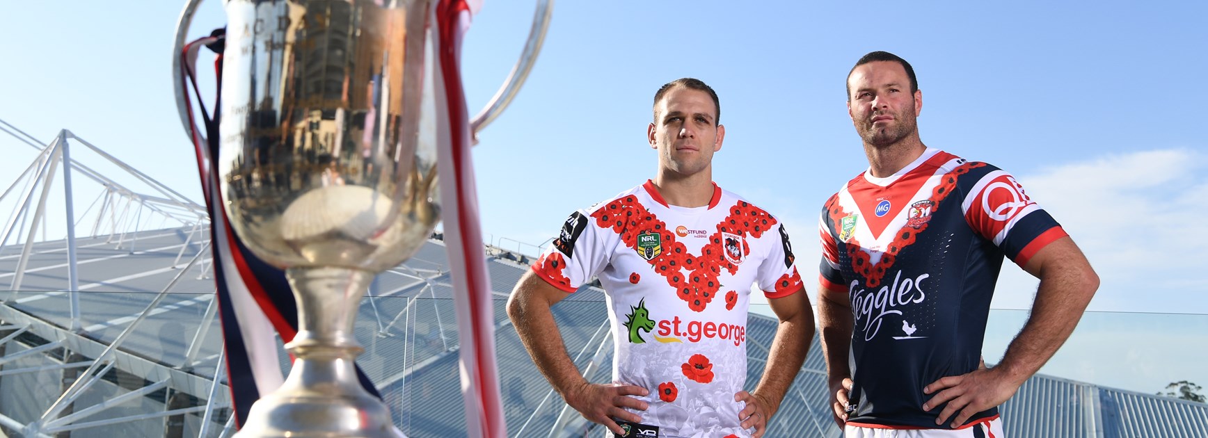 Dragons winger Jason Nightingale (left) and Roosters back-rower Boyd Cordner eye off the Anzac Day Cup.