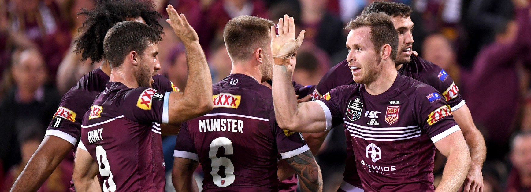 Maroons Michael Morgan and Ben Hunt celebrate.