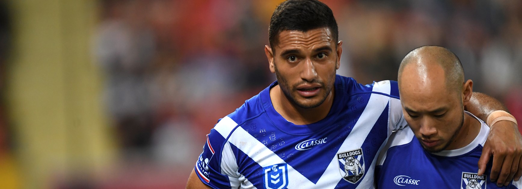 Bulldogs winger Marcelo Montoya leaves the field with a knee injury.