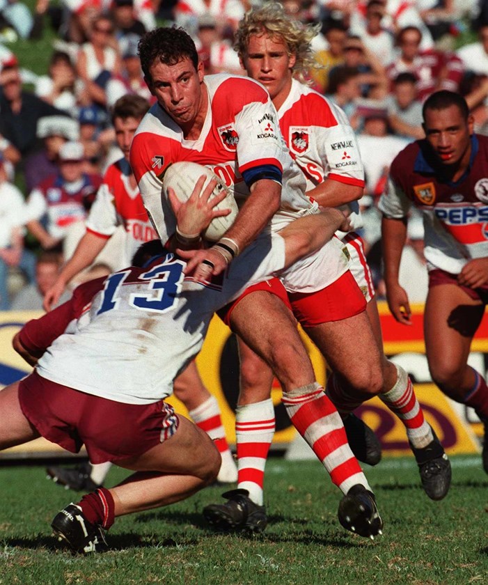 Manly's Nik Kosef tackles Tony Priddle.