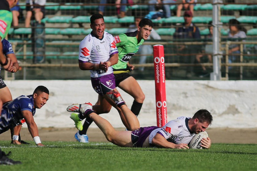 Chris Lewis scores the match-winning try for Melbourne.