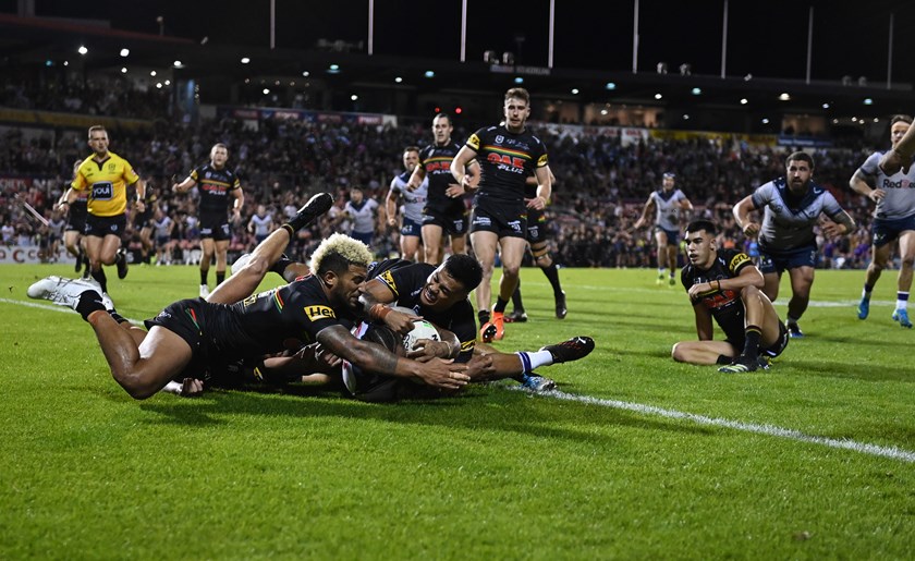Viliame Kikau manages to get a big, meaty Panther paw under the ball to prevent Justin Olam's try.