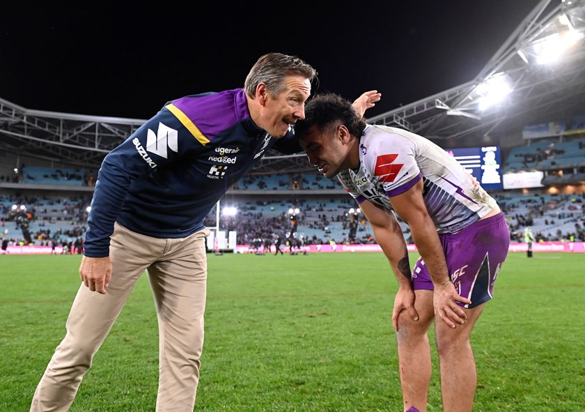 Craig Bellamy catches up with Jahrome Hughes after the siren.