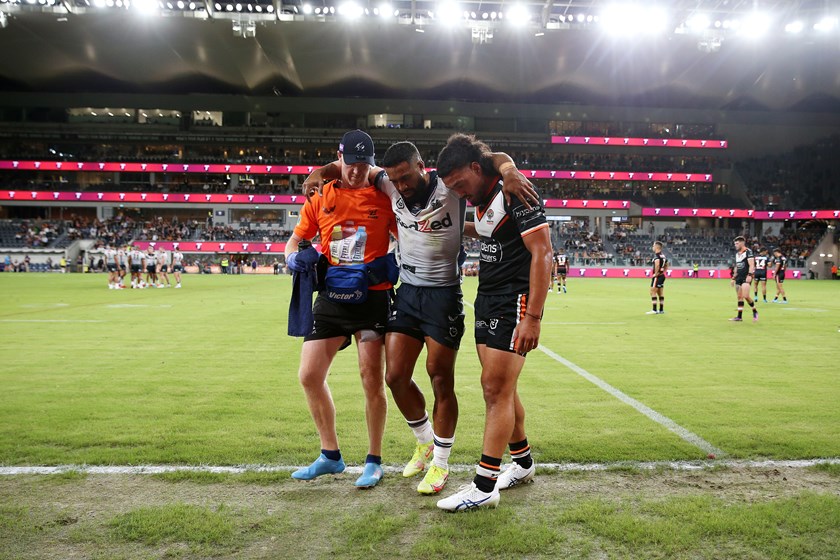 George Jennings is assisted from the field with a suspected ACL injury