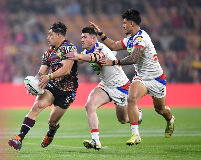 Bradman Best and Enari Tuala attempt to shut down Bronco Kotoni Staggs in Round 22.