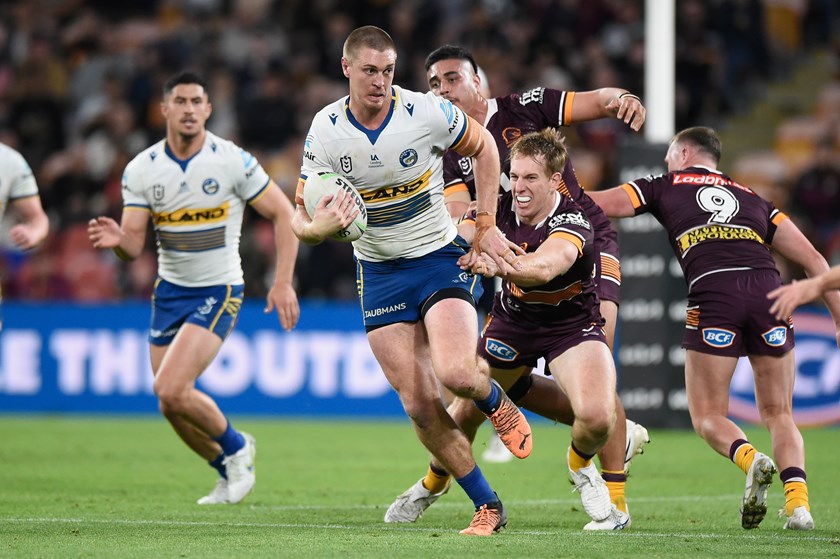 Shaun Lane surges his way through the Broncos defence.