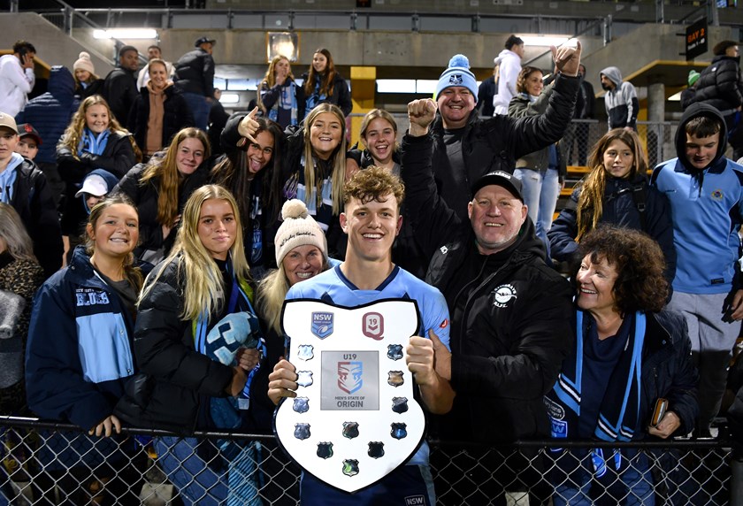 Blues Under 19's winger Jack Bostock with his family after beating Queensland 32-4.