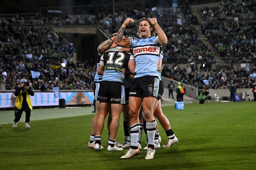 Star playmaker Nicho Hynes celebrates Cronulla's defeat of the Raiders.