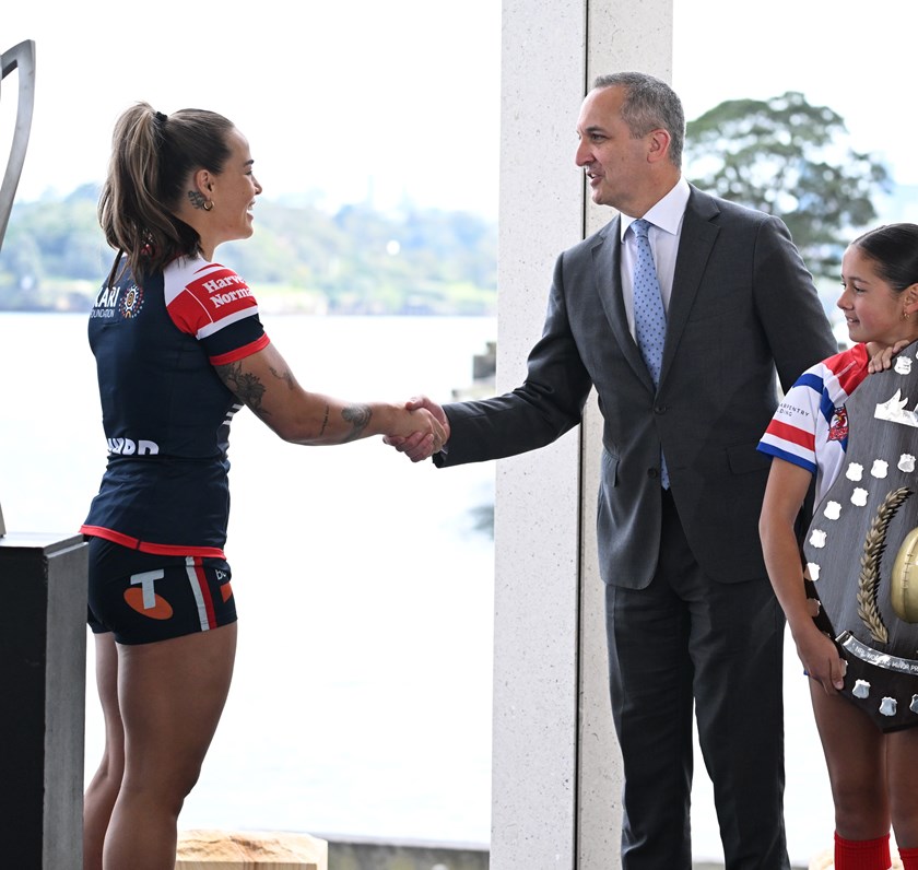 NRL CEO Andrew Abdo congratulates Sydney Roosters captain Isabelle Kelly on the club's minor premiership win.