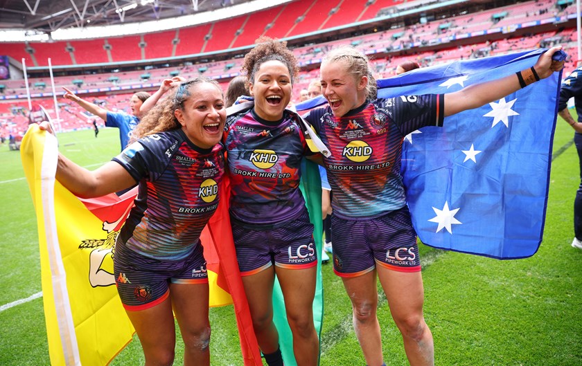Australians Shaniah and Tiana Power, and Remi Wilton, celebrate after helping Wigan to their first Women's Challenge Cup win at Wembley Stadium.