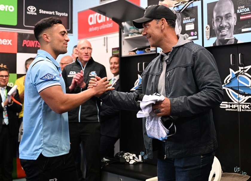 KL Iro receives his Sharks jersey from father Kevin after debuting in 2022.