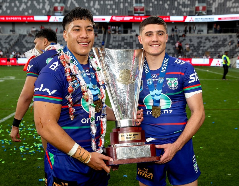 Jett Cleary (right) and Warriors team-mate Jason Salalilo celebrate the club's NSW Cup win.
