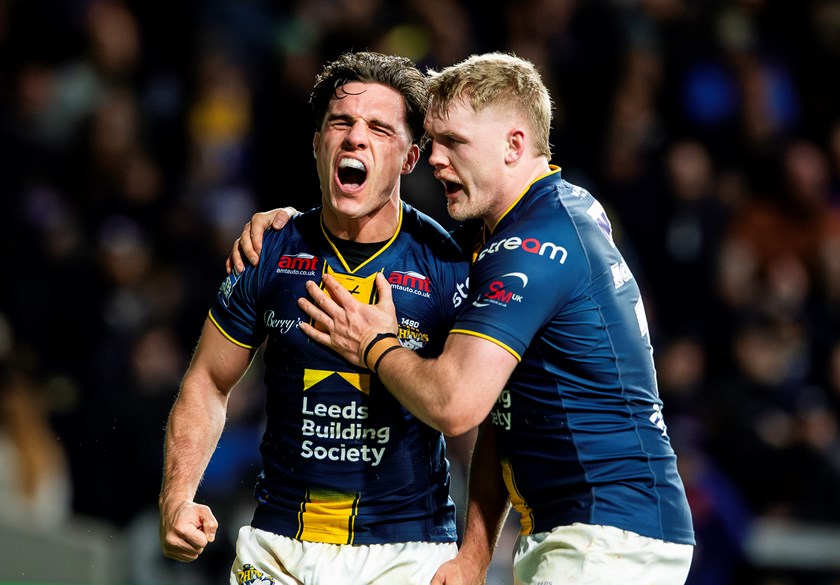Brodie Croft and James McDonnell celebrate a Leeds try in the win over York.