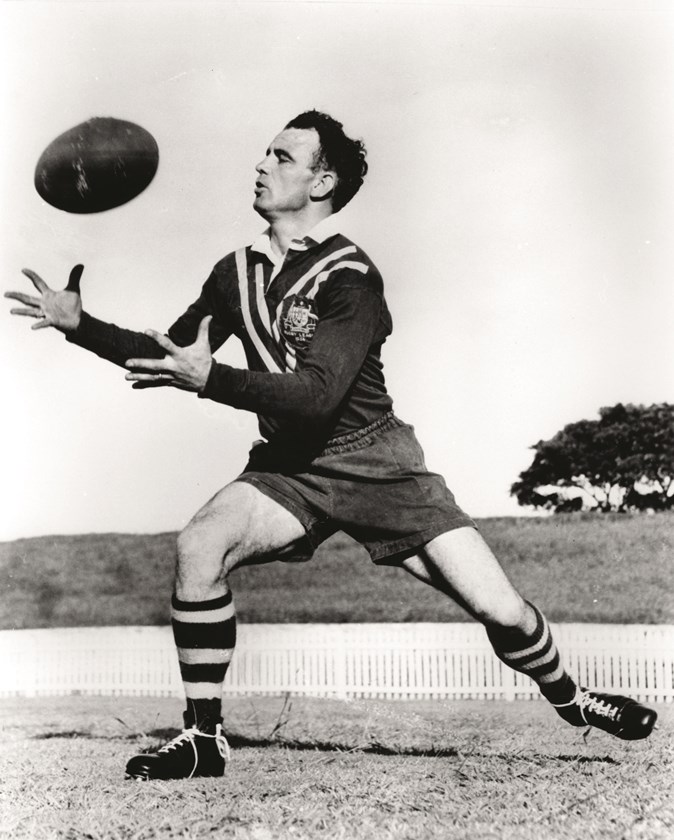 Churchill demonstrates correct catching technique for this coaching manual image.